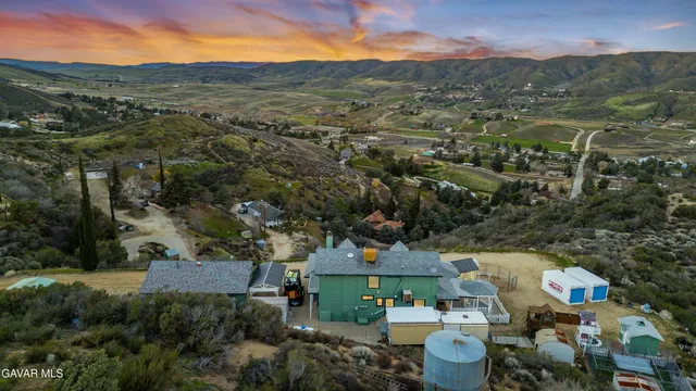 a view of a yard with mountains in the background