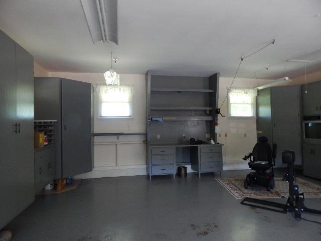 820 Spring Valley Road McMinnville, TN 37110 - Photo 23 of 30 Get a load of the storage in the garage. Pull down attic access also