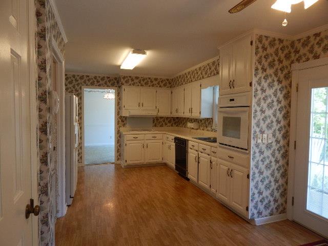 820 Spring Valley Road McMinnville, TN 37110 - Photo 7 of 30 From large utility into kitchen. Pantry to your left and patio doors to covered back porch to your right