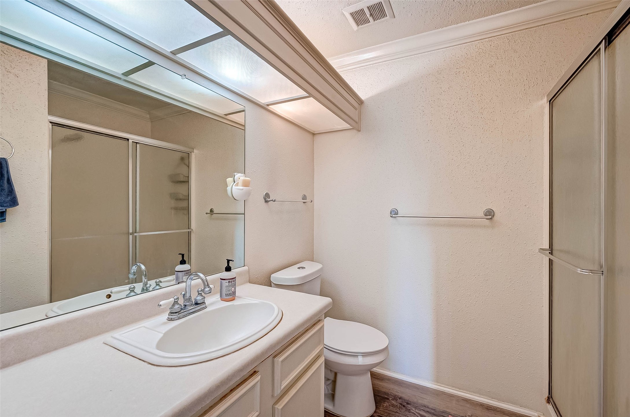 1908 Augusta Drive, Unit 7 Houston, TX 77057 - Photo 23 of 33 a bathroom with a sink toilet and shower