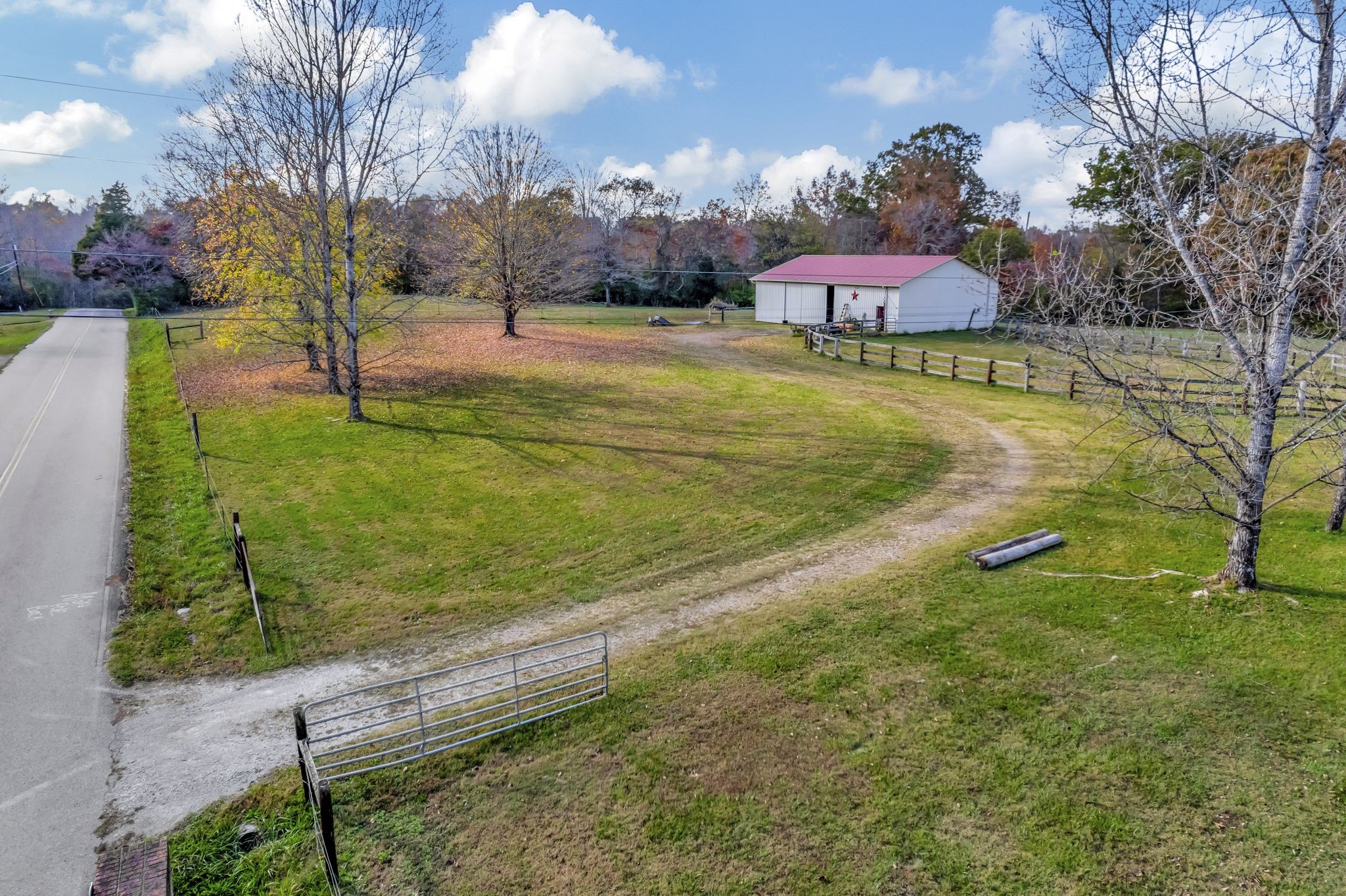 7711 Fernvale Road Fairview, TN 37062 - Photo 16 of 17 a view of a lake with a yard and large trees