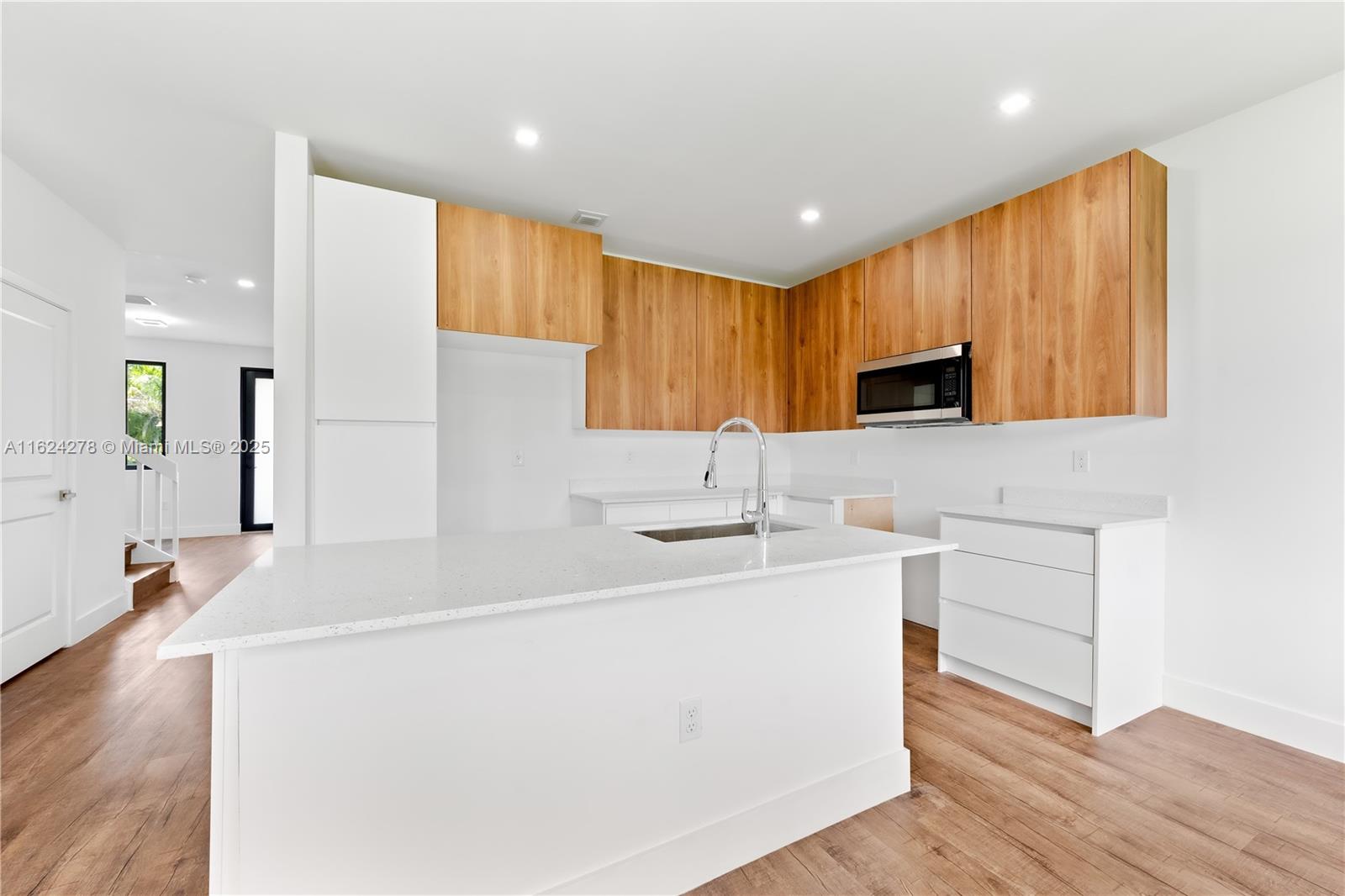 866 Southwest 1st Street Florida City, FL 33034 - Photo 13 of 52 a kitchen with a sink appliances and cabinets