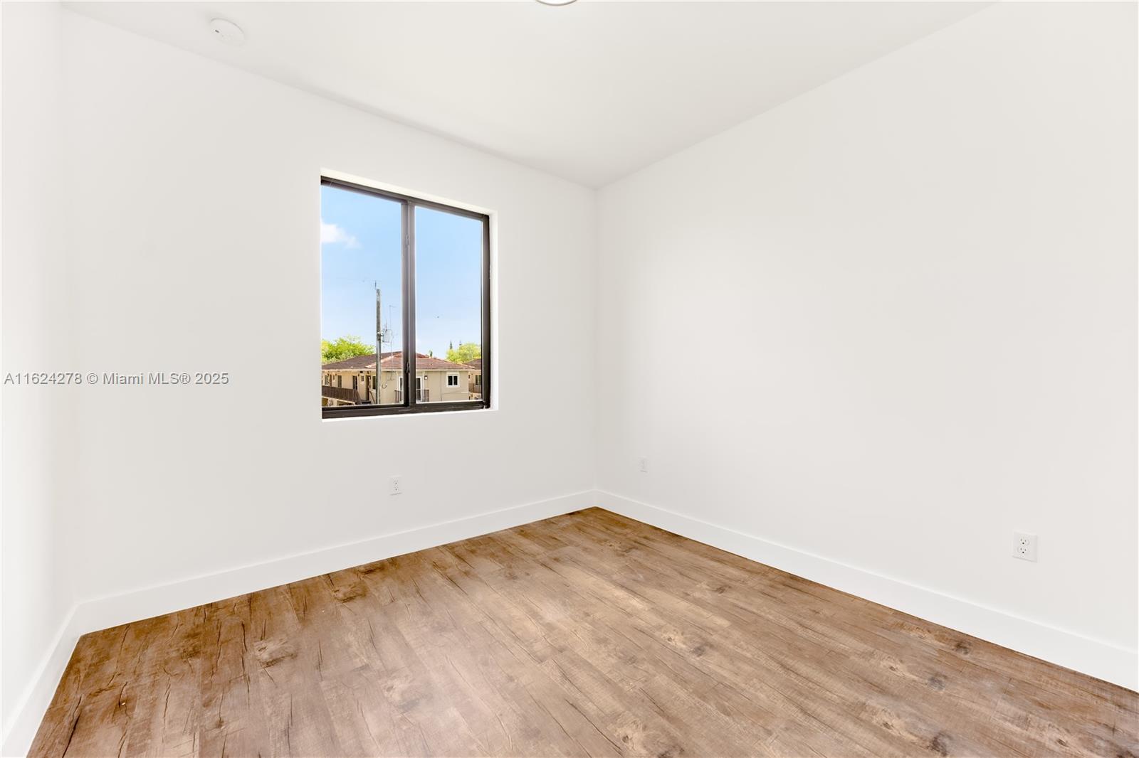 866 Southwest 1st Street Florida City, FL 33034 - Photo 24 of 52 a view of empty room with wooden floor