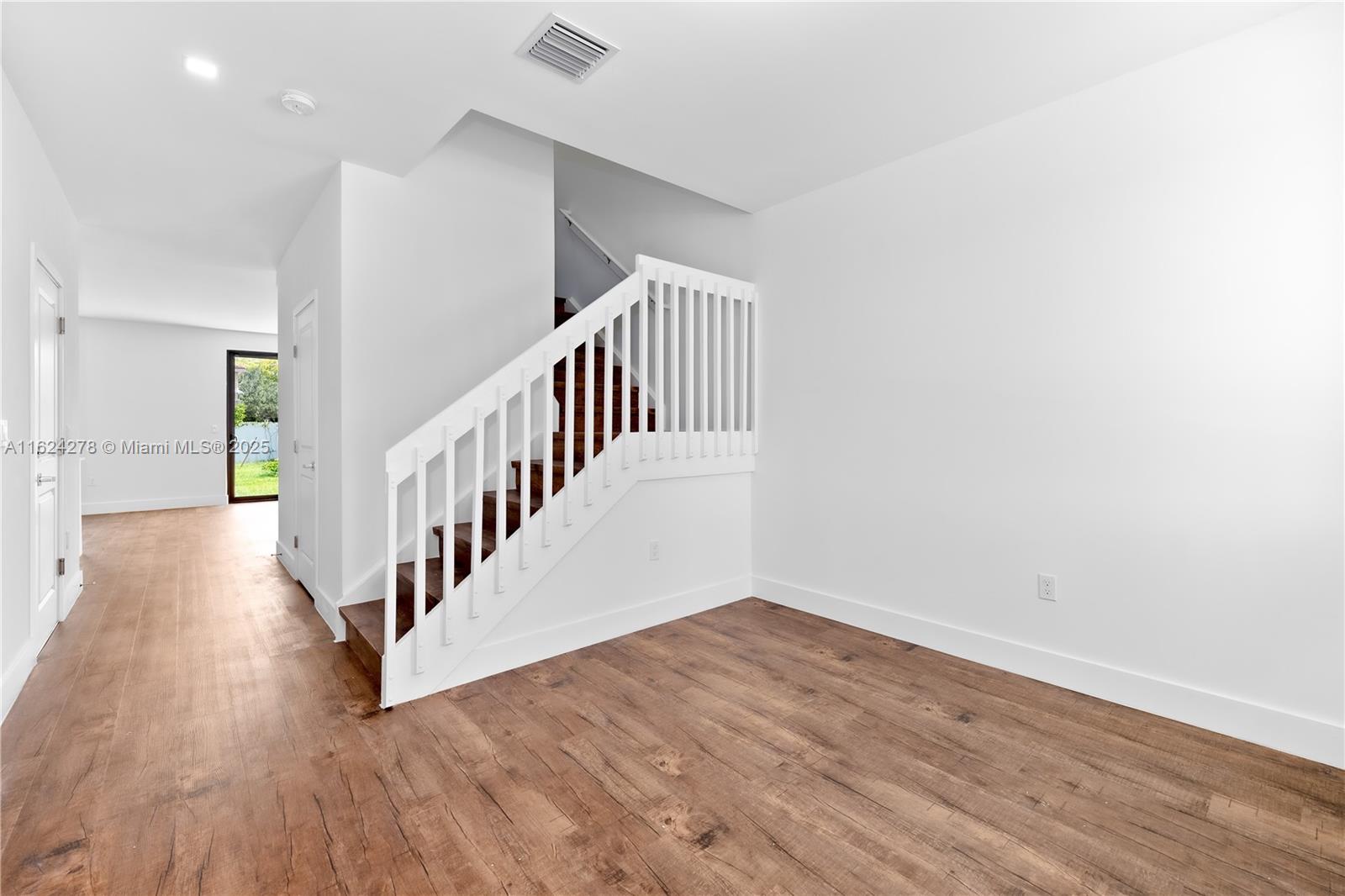 866 Southwest 1st Street Florida City, FL 33034 - Photo 4 of 52 a view of staircase with wooden floor