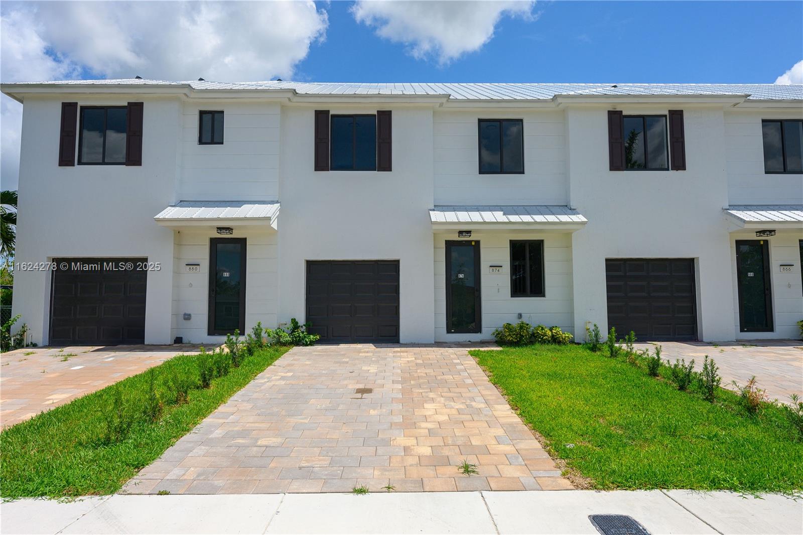 866 Southwest 1st Street Florida City, FL 33034 - Photo 50 of 52 a front view of a house with a yard and garage