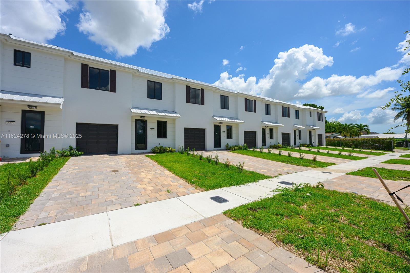 866 Southwest 1st Street Florida City, FL 33034 - Photo 51 of 52 a front view of a house with a yard and potted plants