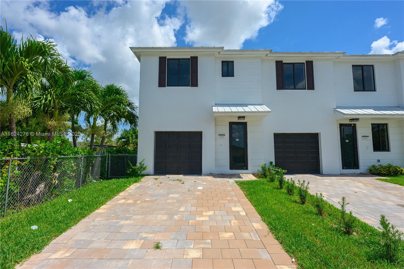 866 Southwest 1st Street Florida City, FL 33034 - Photo 52 of 52 a front view of a house with a yard and potted plants
