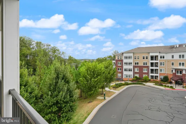 a view of a swimming pool with a patio and a yard