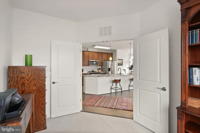 a view of a hallway with a hallway and wooden floor