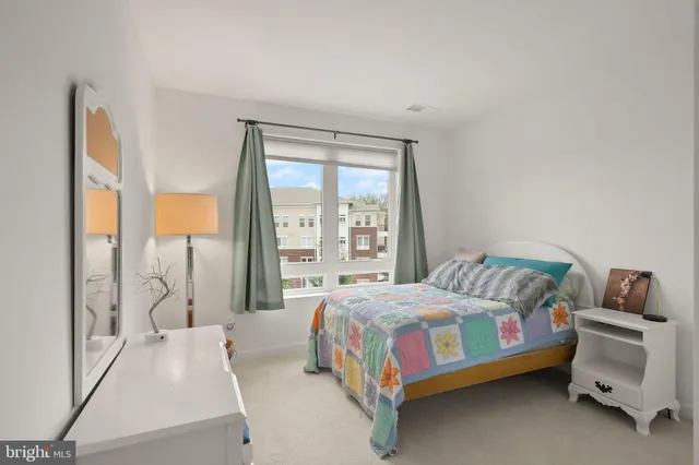 a bedroom with a bed and a fireplace