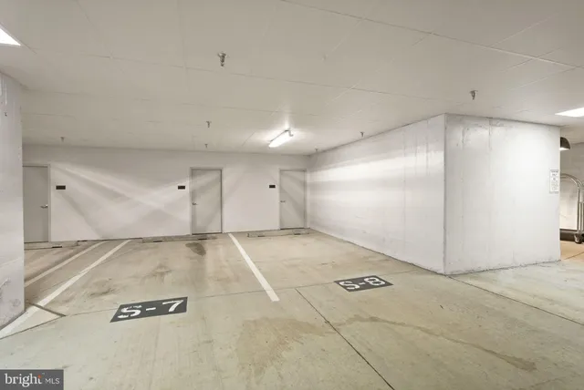 a room with stainless steel appliances and cabinets