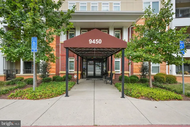 a front view of a building with garden