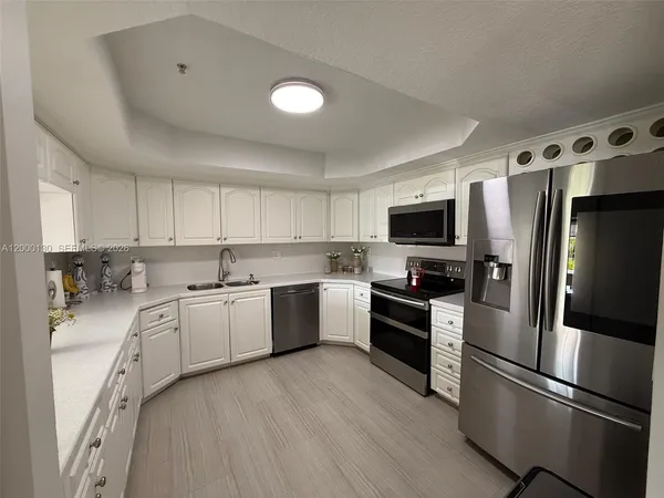 $455,000 | 17455 Northwest 75th Place, Unit 203, Hialeah, FL 33015
