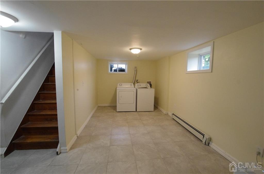 127 Blair Road Port Reading, NJ 07064 - Photo 12 of 17 a view of a livingroom with stairs and stairs