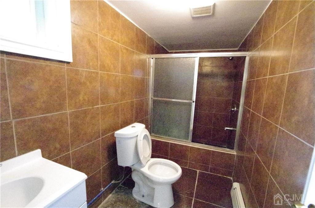 127 Blair Road Port Reading, NJ 07064 - Photo 17 of 17 a bathroom with a sink and toilet