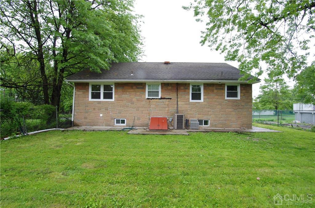 127 Blair Road Port Reading, NJ 07064 - Photo 4 of 17 a view of a house with a backyard