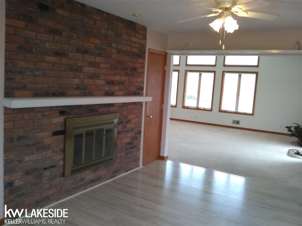 70727 Fisher Road Romeo, MI 48065 - Photo 11 of 32 2 Sided Fireplace!