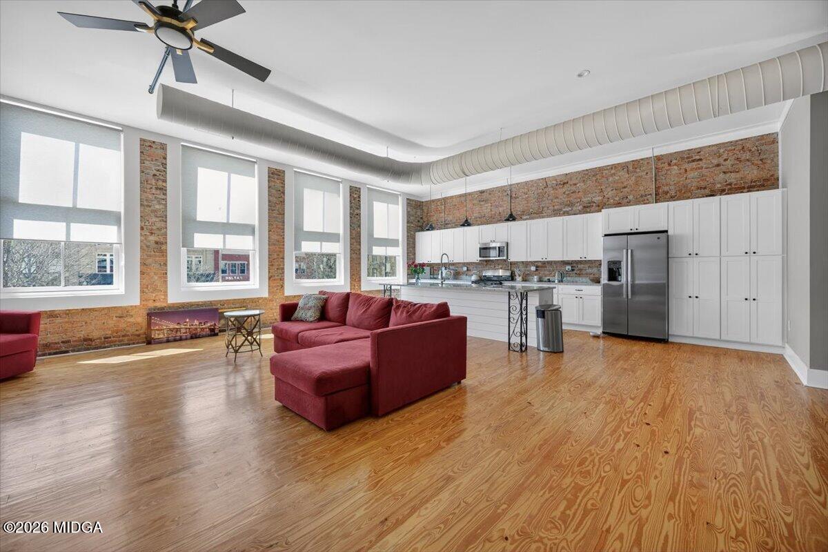 565 Poplar Street Macon, GA 31201 - Photo 2 of 12 a living room with furniture and kitchen view