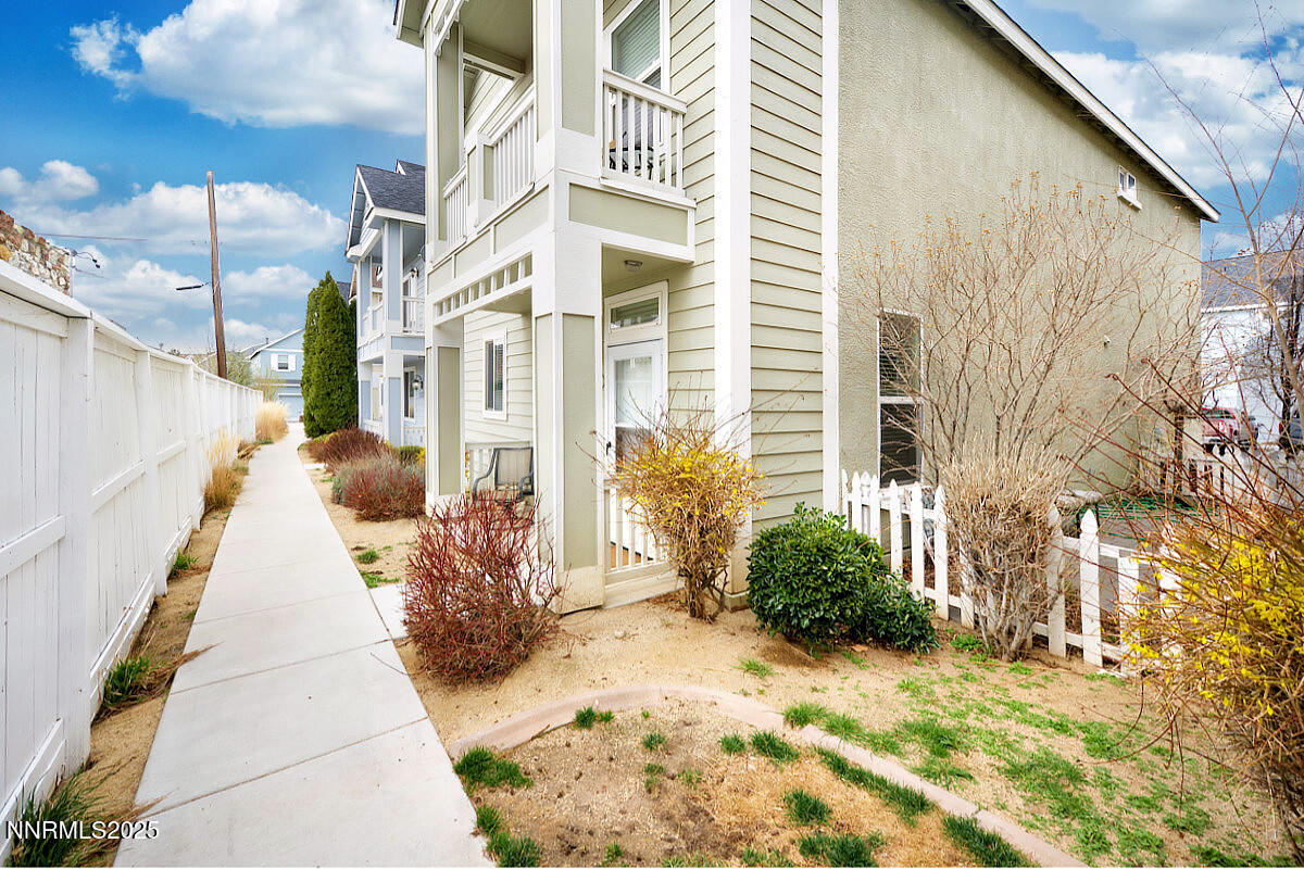 a view of a pathway along with potted plants