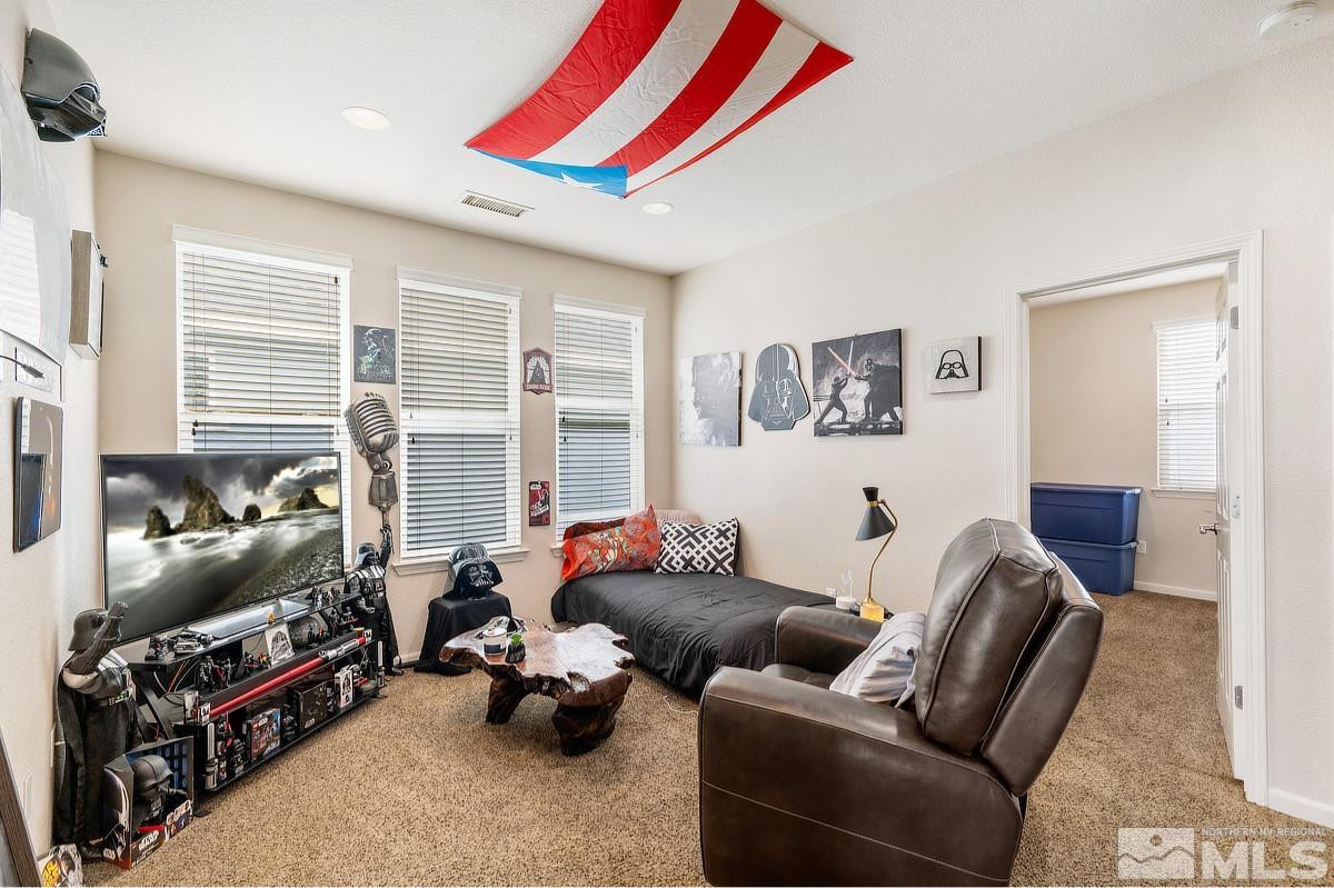 2020 Alamo Square Way Reno, NV 89509 - Photo 15 of 23 a living room with furniture a flat screen tv and a couch