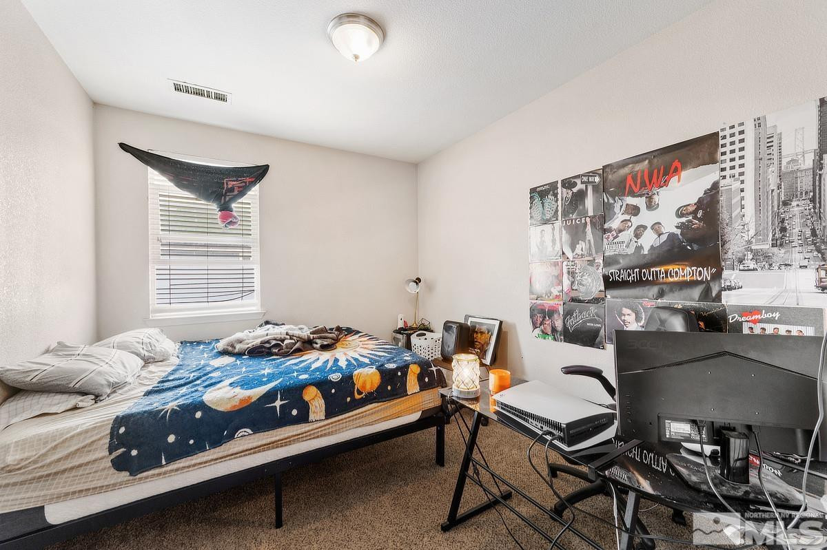2020 Alamo Square Way Reno, NV 89509 - Photo 17 of 23 a bedroom with furniture and a window