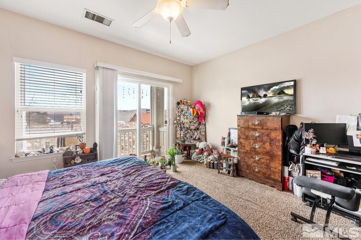 2020 Alamo Square Way Reno, NV 89509 - Photo 20 of 23 a bedroom with bed and a flat tv screen