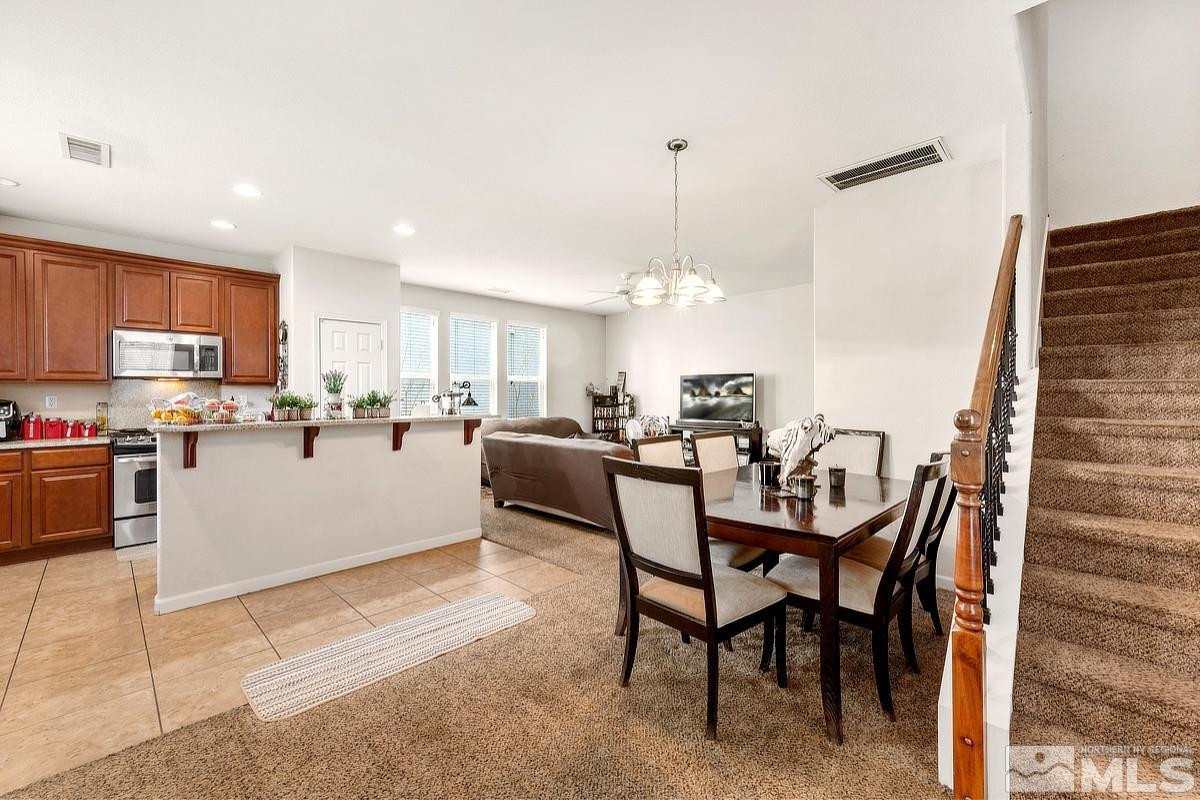 2020 Alamo Square Way Reno, NV 89509 - Photo 4 of 23 a living room with stainless steel appliances kitchen island granite countertop furniture and a kitchen view