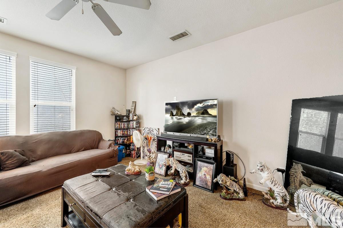 2020 Alamo Square Way Reno, NV 89509 - Photo 7 of 23 a living room with furniture and a flat screen tv