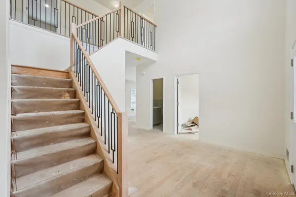 a view of staircase with wooden floor and stairs