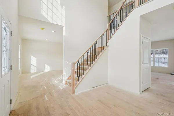 a room with a bed and a window