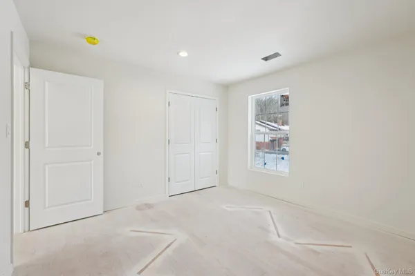 a view of a hallway with windows