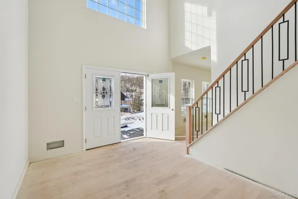 a view of a hallway with staircase