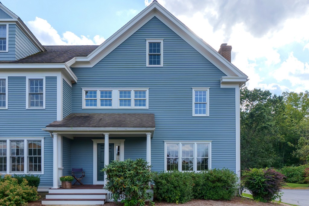35 Lancaster County Road, Unit 4C Harvard, MA 01451 - Photo 1 of 2 a view of brick house with large windows