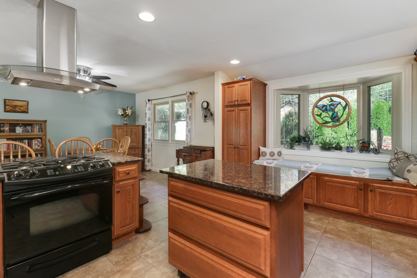 502 Jersey Avenue Normal, IL 61761 - Photo 11 of 46 a kitchen with stainless steel appliances granite countertop a stove and a sink