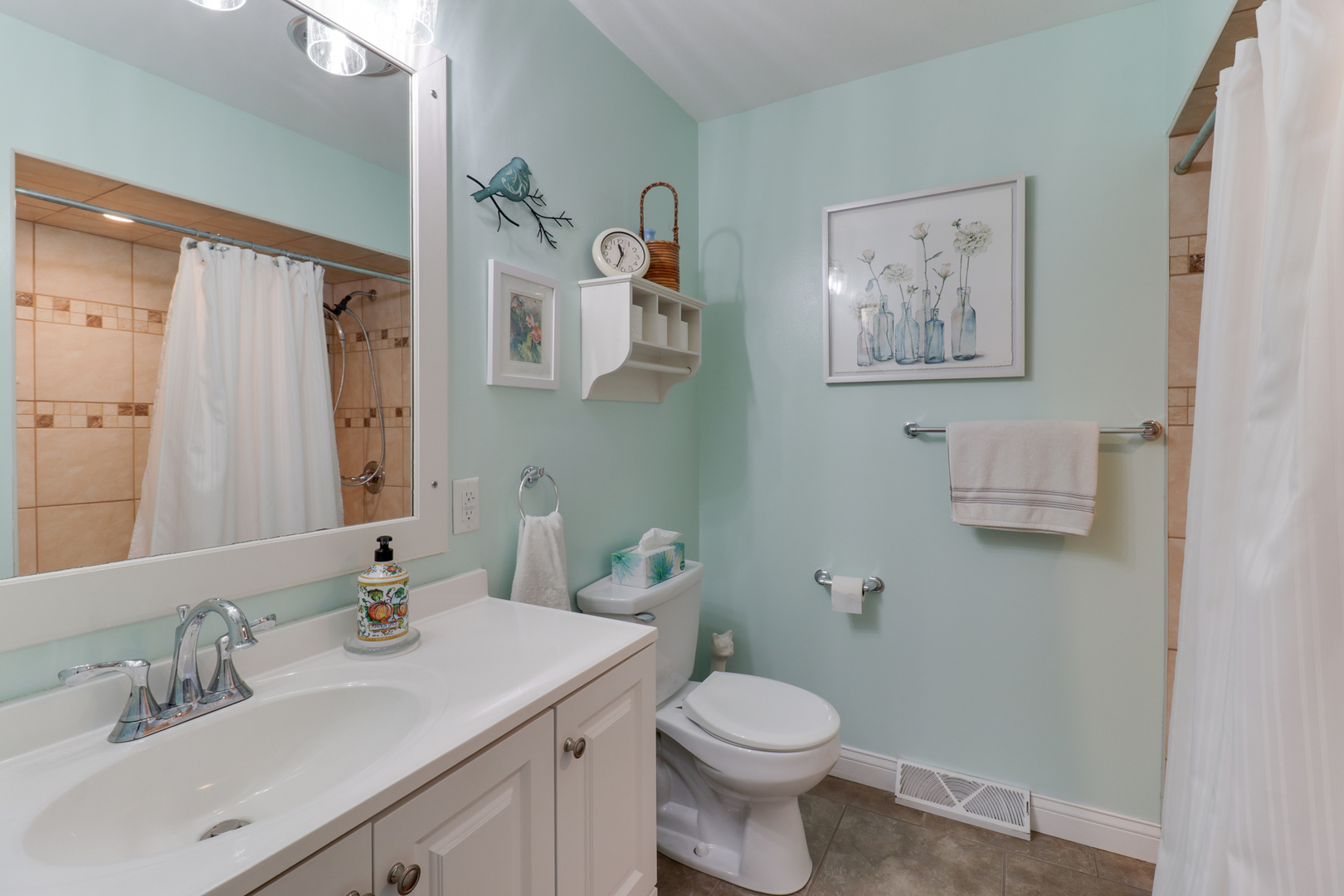 502 Jersey Avenue Normal, IL 61761 - Photo 14 of 46 a bathroom with a toilet a sink and mirror