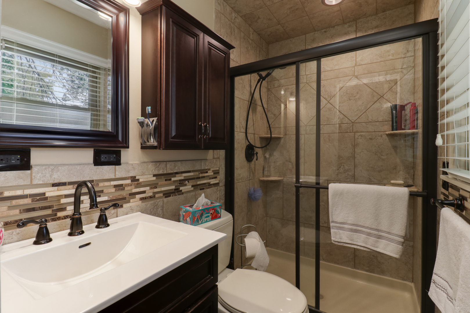 502 Jersey Avenue Normal, IL 61761 - Photo 16 of 46 a bathroom with a sink toilet and shower