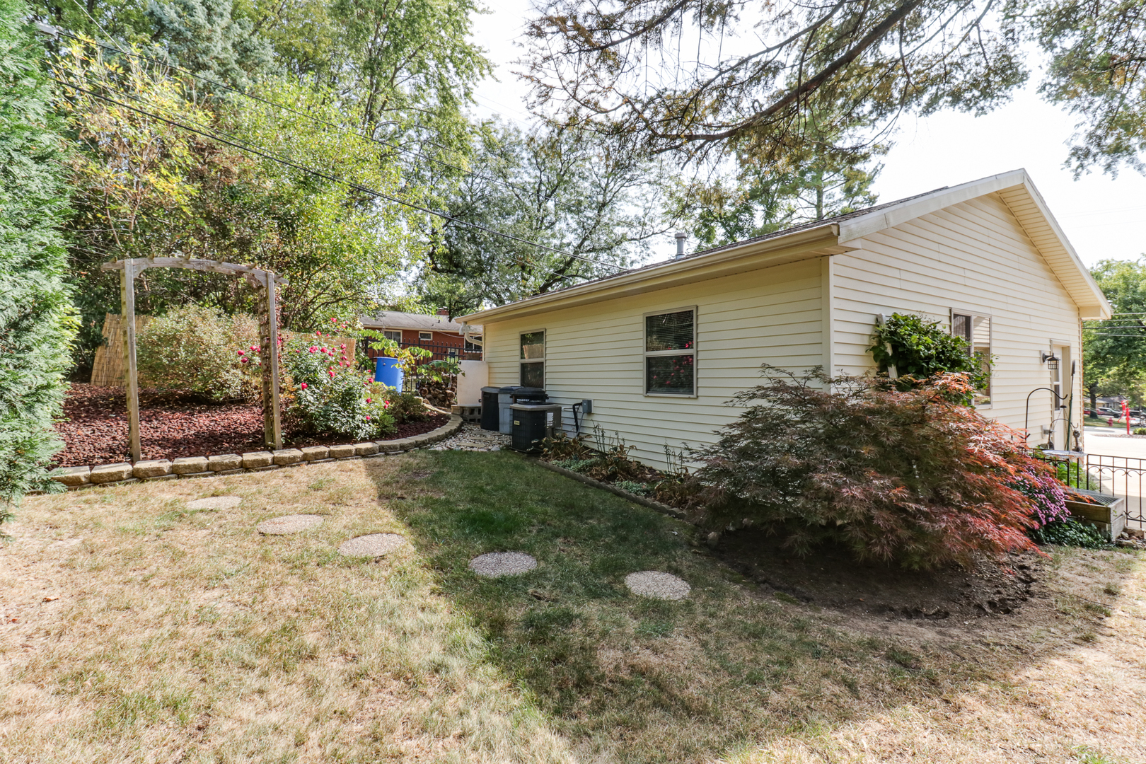 502 Jersey Avenue Normal, IL 61761 - Photo 24 of 46 a view of a backyard with plants and a patio