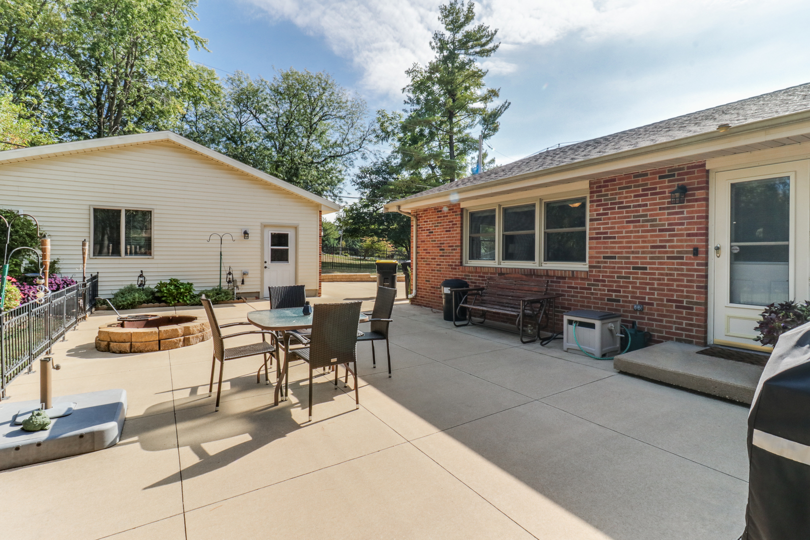 502 Jersey Avenue Normal, IL 61761 - Photo 36 of 46 a view of a patio with couches table and chairs and potted plants