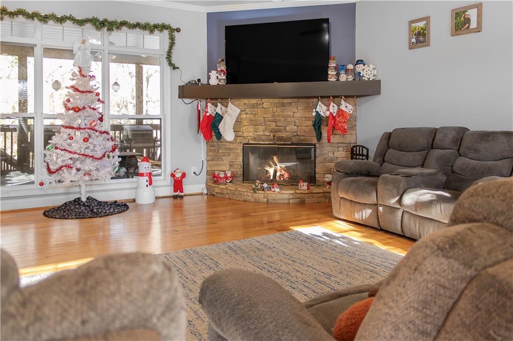 235 Brooks Road Pendergrass, GA 30567 - Photo 6 of 33 a living room with furniture and a flat screen tv