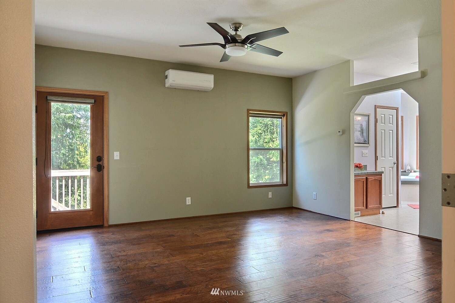 4704 Whiteman Road Southwest Longbranch, WA 98351 - Photo 12 of 40 wooden floor in an empty room with a window