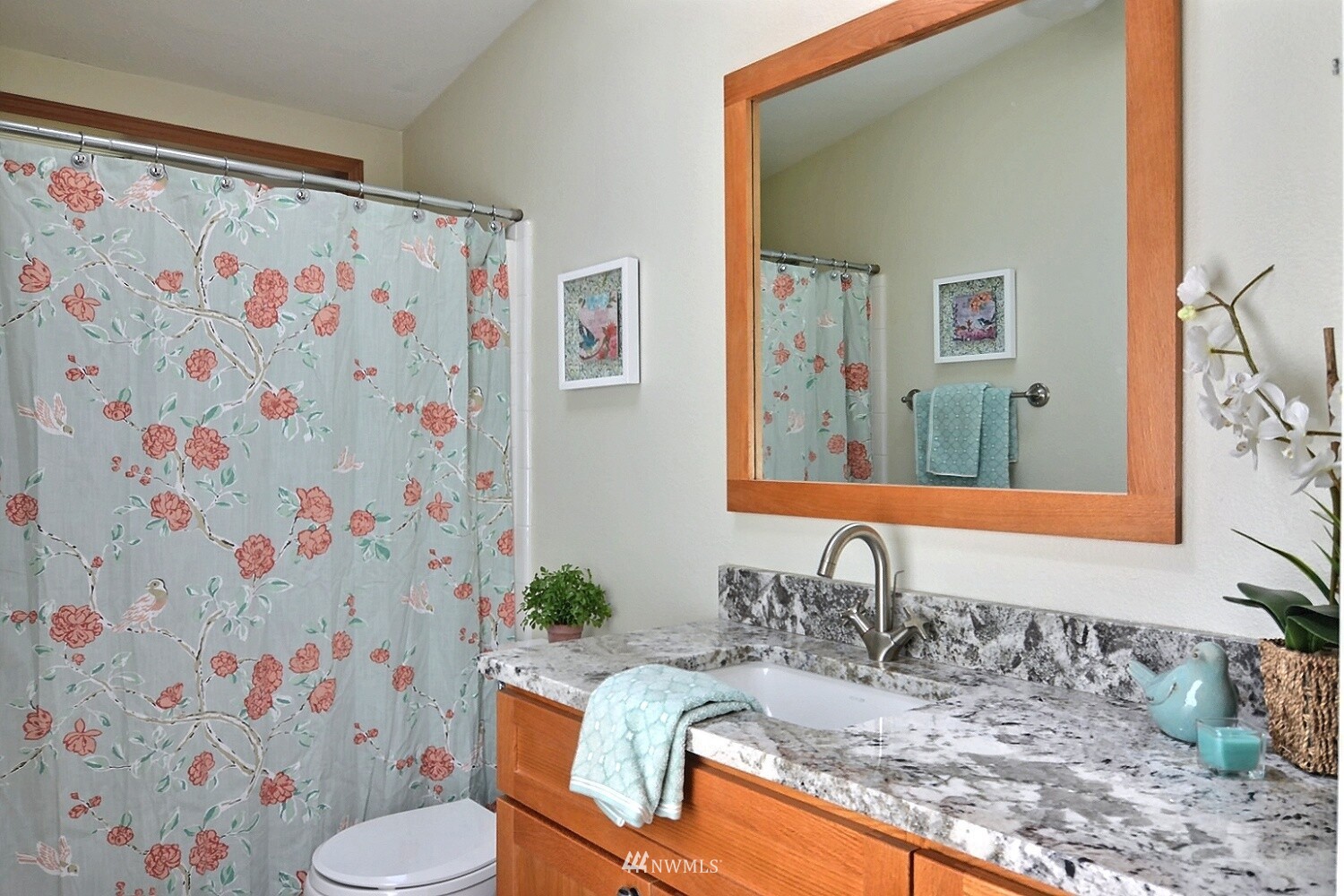 4704 Whiteman Road Southwest Longbranch, WA 98351 - Photo 19 of 40 a bathroom with a granite countertop sink and a mirror