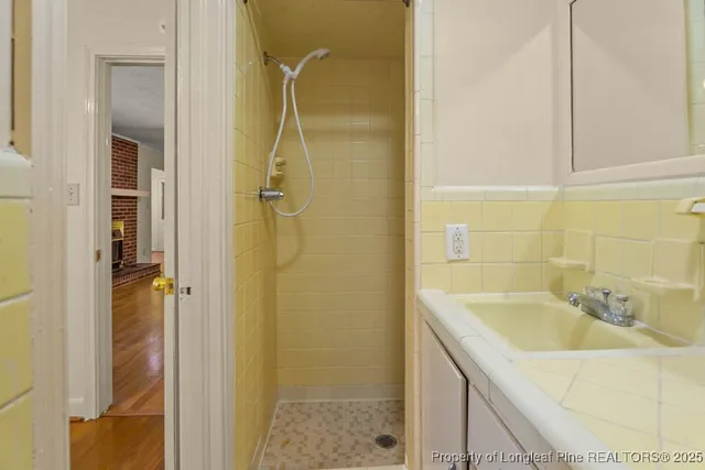 a bathroom with a sink and shower
