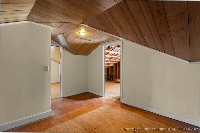 a view of a room with wooden walls