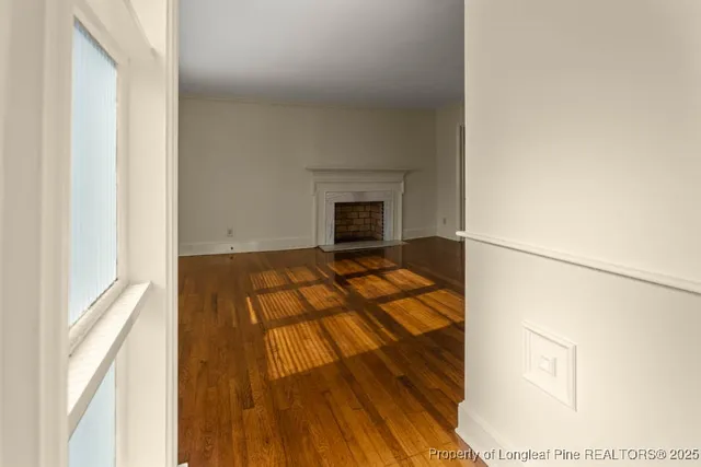 a view of a living room with a fireplace