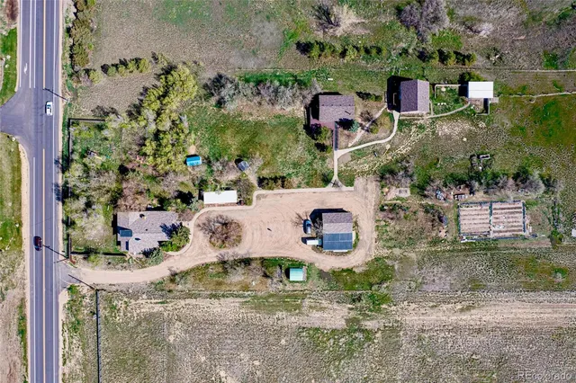 an aerial view of residential house with outdoor space and parking