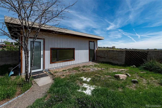 a backyard of a house with lots of green space