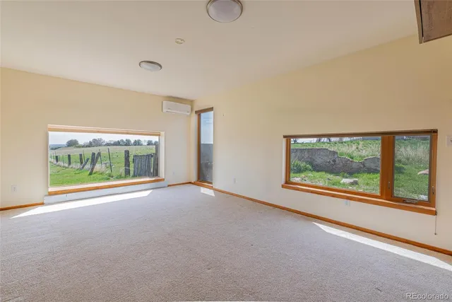 a view of room with floor to ceiling window