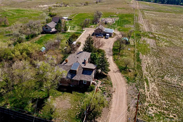 an aerial view of residential house with outdoor space