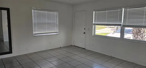 a view of an empty room with a window