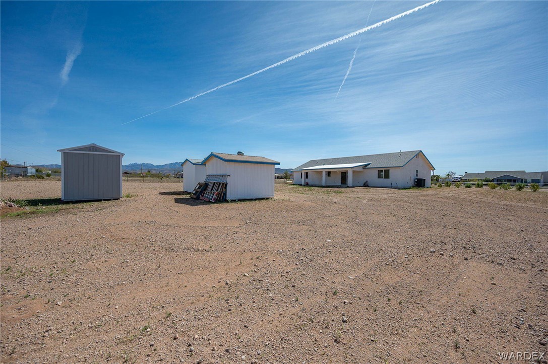 3411 West Carmichael Road Golden Valley, AZ 86413 - Photo 52 of 97 View of yard featuring an outbuilding